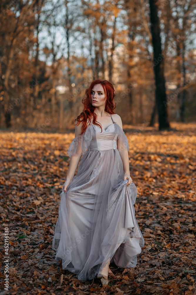 Portrait of young redhead woman in autumn yellow park Portrait of young redhead woman in autumn yellow park