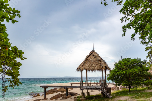 Nature in twilight period which including of sunrise over the sea and the nice beach. Summer beach with blue water and purple sky at the sunset.  