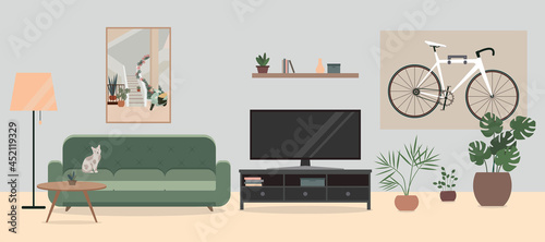 Cozy Living room interior with TV, sofa, flowers in pots, and a bicycle. Bike hanging on the wall in living room.