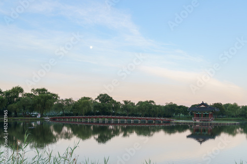 Bright shot of the Chwihyanggyo bridge over the sea leading to the Hyangwon Pavilion in South Korea photo