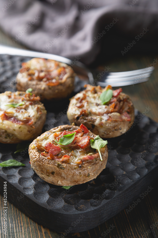 Baked mushrooms stuffed with cheese and bacon Baked mushrooms stuffed with cheese and bacon