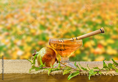 Honey is sweet symbols of Jewish New Year - Rosh Hashanah, blurred autumnal b...