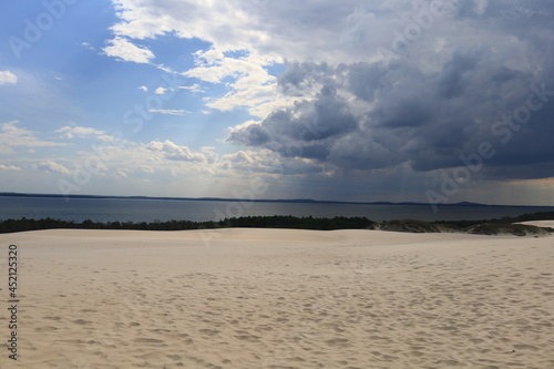 rainy clouds over sand dunes in park