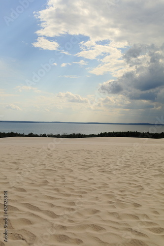 rainy clouds over sand dunes in park