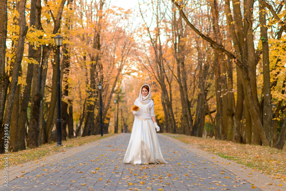Young woman in a autumn park. Lady with a leafs. Young woman in a autumn park. Lady with a leafs.