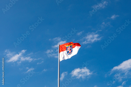 flag of Hesse under blue sky in Germany