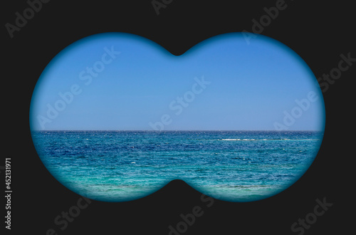 Sea view through binoculars. Seascape view via the field-glass. 