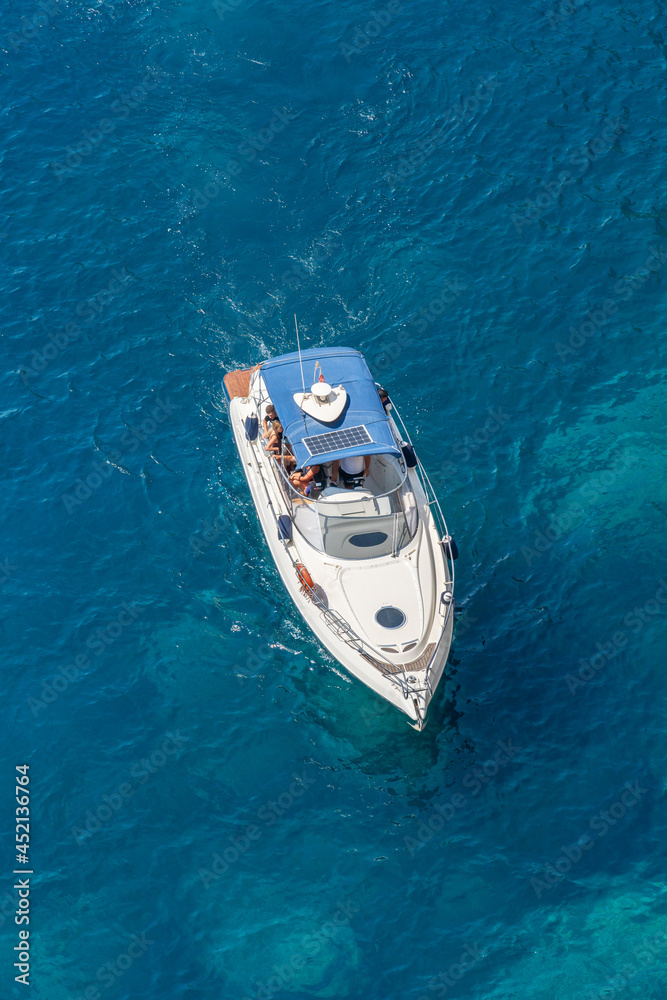 Aerial view of a passenger boat on a blue sea