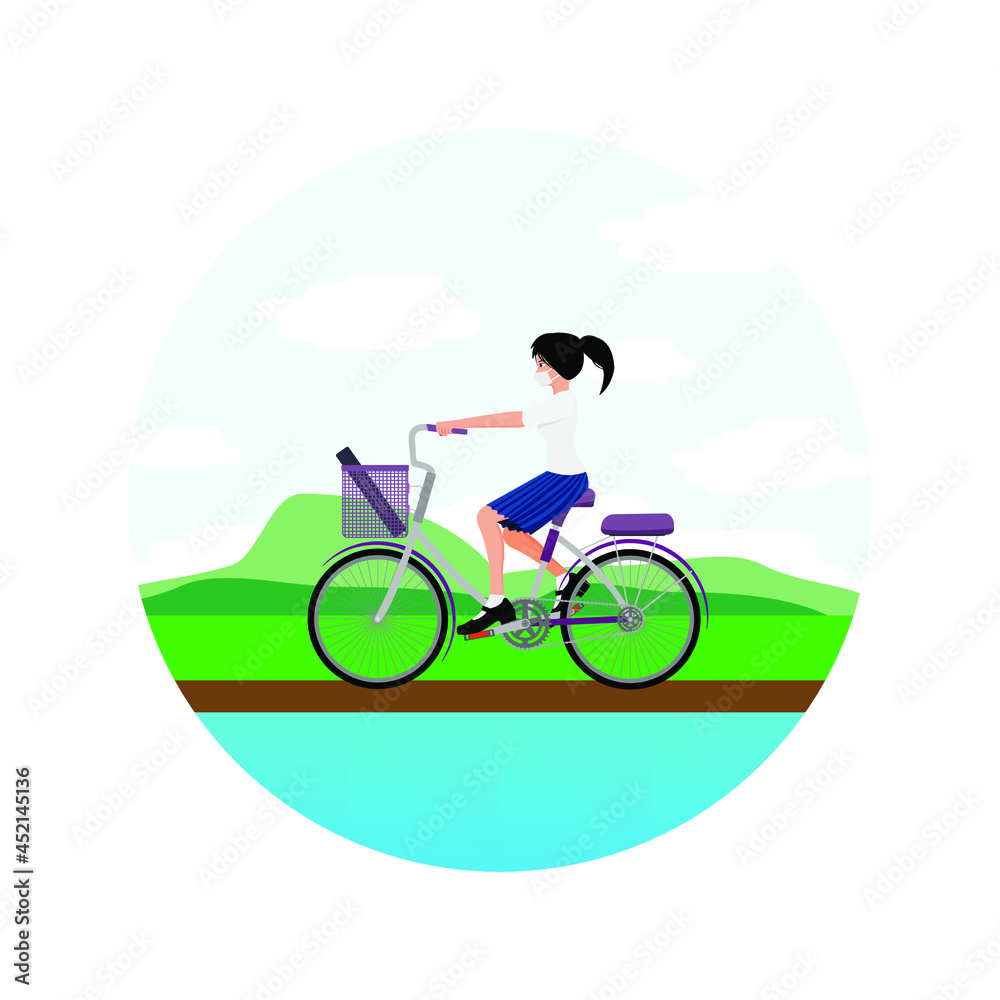 Naklejka premium A girl riding a bicycle in the countryside