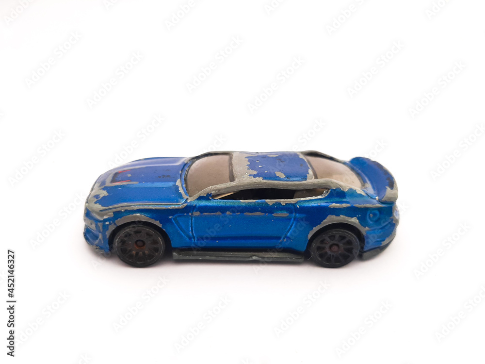 blue old car toy on white background