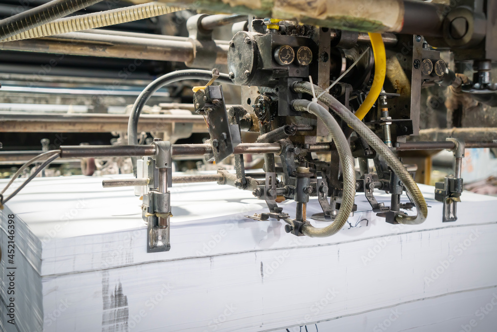 The offset press in the production process in the printing factory The offset press in the production process in the printing factory