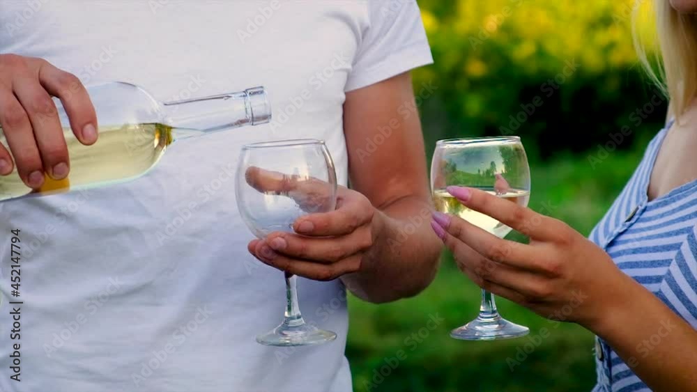 Picnic in nature with wine lovers together. Selective focus. Picnic in nature with wine lovers together. Selective focus.