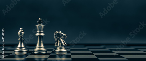 Obraz na płótnie Close-up King chess Bishop and Knight standing teamwork on chess board concepts of business team and leadership strategy and organization risk management or team player