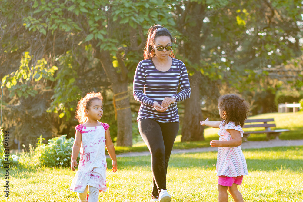 Fototapeta premium Happy young mother hispanic with her daughter at park