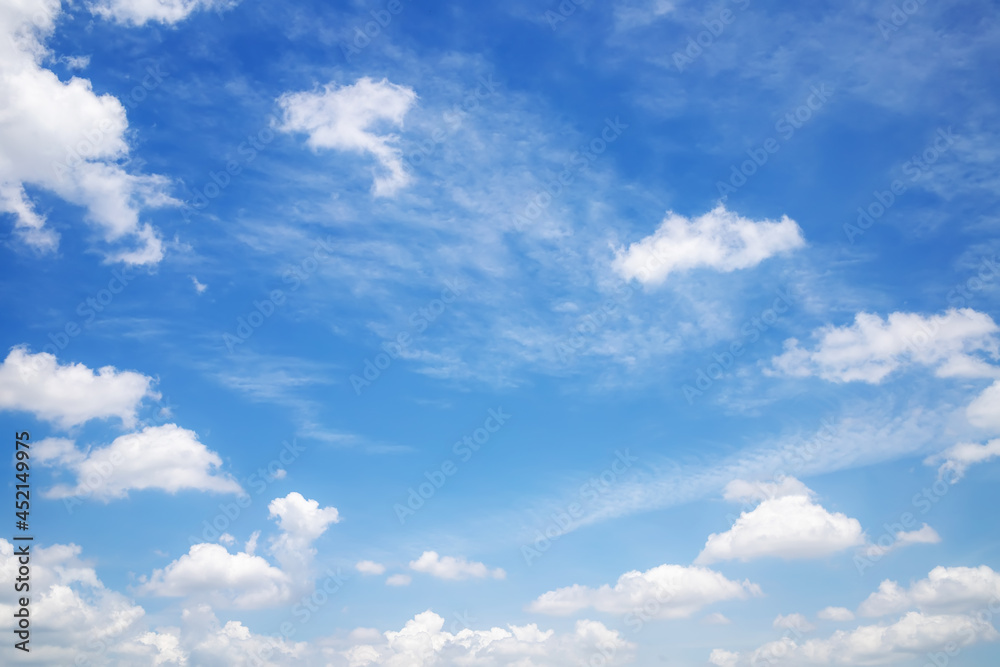 The background image of a beautiful blue sky with some white clouds in the daytime. The background image of a beautiful blue sky with some white clouds in the daytime.