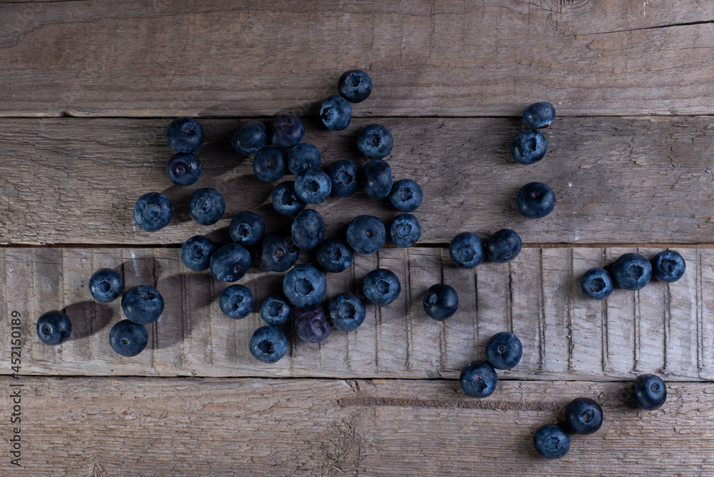 blueberries on a wooden table in a rustic style blueberries on a wooden table in a rustic style