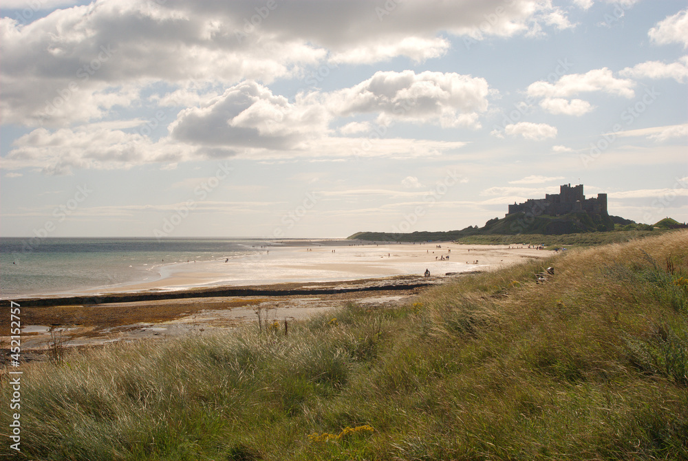 Bamburgh castle coast and beach in summer Bamburgh castle coast and beach in summer