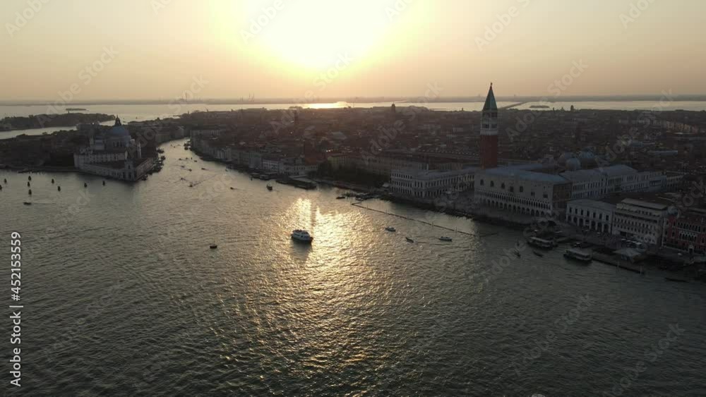 Aerial view of Venice canal. Famous St Mark's Square (Piazza San Marco), St Mark's Basilica and Doge's Palace in historic center of city at sunset Italy Aerial view of Venice canal. Famous St Mark's Square (Piazza San Marco), St Mark's Basilica and Doge's Palace in historic center of city at sunset Italy