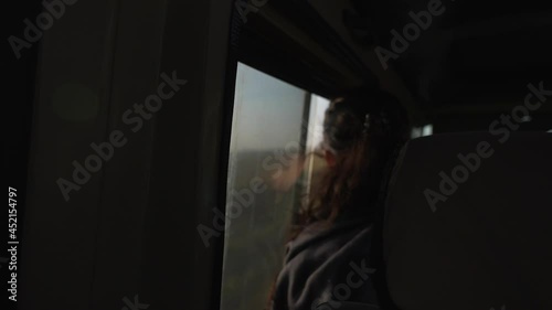 Wallpaper Mural Woman looking at the animals through the window of a car. Serengeti National Park during the game drive. Africa 4K. Torontodigital.ca