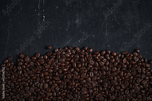 Coffee beans on dark background.