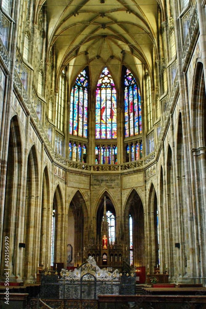 Stained glass window at the end of the main nave in St. Vitus Cathedral in Prague Castle, Prague, Czech Republic