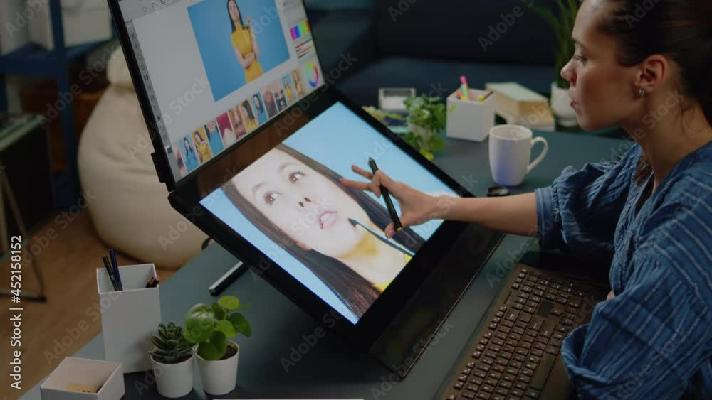 Close up of retouching software on touch screen at studio. Photographer working on editing app for pictures design. Image editor doing retouch work on photo using graphic tablet. Close up of retouching software on touch screen at studio. Photographer working on editing app for pictures design. Image editor doing retouch work on photo using graphic tablet.