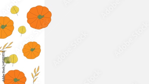 Bright colored autumn leaves and orange pumpkins down left hand side with copy space on grey background. Fall, seasonal. Thanksgiving.