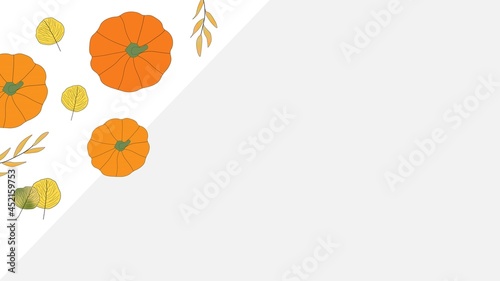 Bright colored autumn leaves and orange pumpkins in top left corner with copy space on grey background. Fall, seasonal. Thanksgiving.