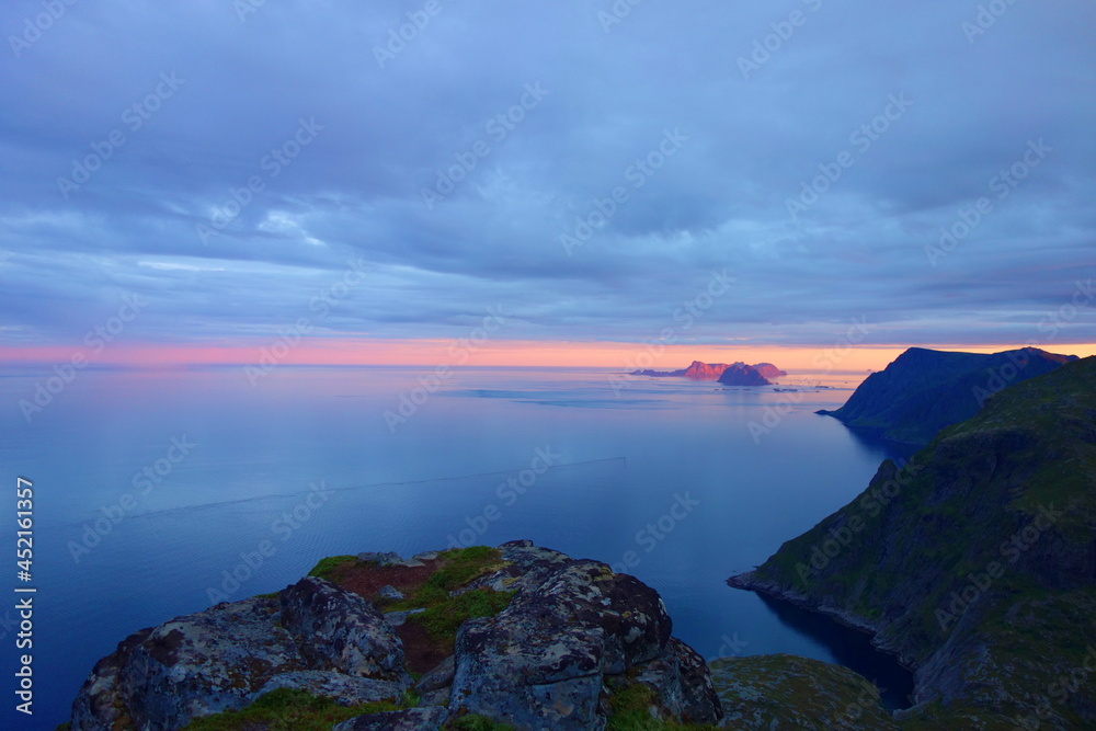 Vaeroya island mountain range during summer sunset in Lofoten, Norway