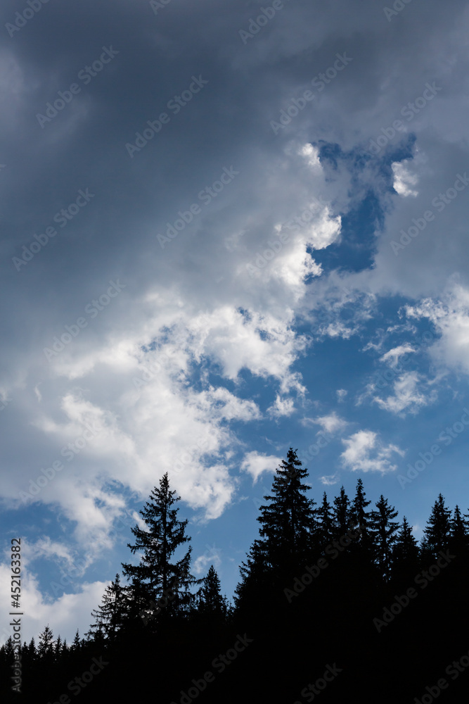 A view of the sky with the Sun behind clouds A view of the sky with the Sun behind clouds
