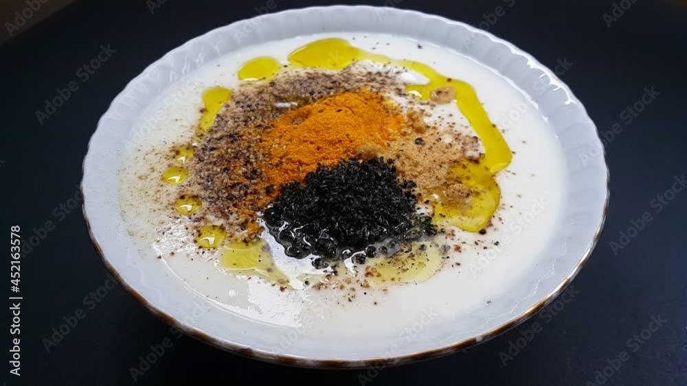 Mixture of yogurt, black cumin, turmeric and black pepper Mixture of yogurt, black cumin, turmeric and black pepper