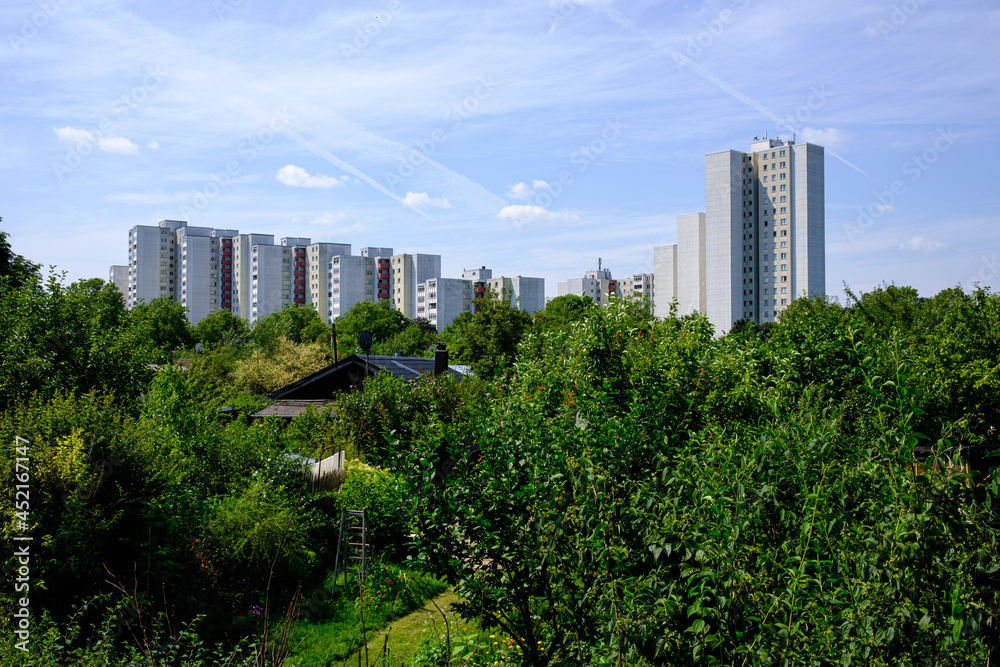 Social housing in berlin with allotment gardens in the foreground.