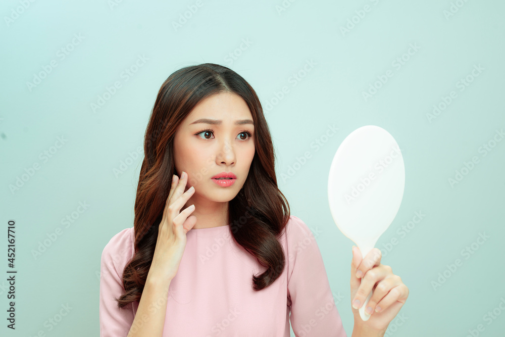 face of young beautiful healthy woman looking in the mirror face of young beautiful healthy woman looking in the mirror