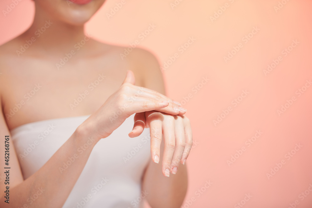 Naklejka premium Woman in underwear applies cream on dry hands