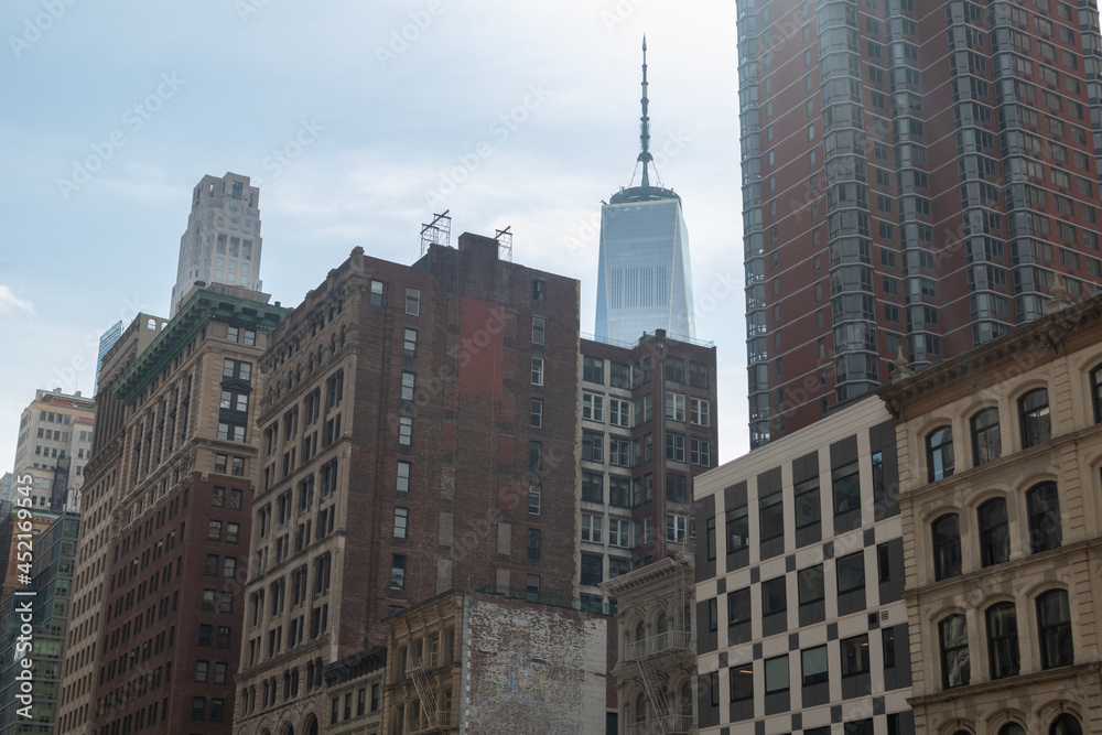 Old and Modern Buildings and Skyscrapers along a Street in Lower Manhattan of New York City Old and Modern Buildings and Skyscrapers along a Street in Lower Manhattan of New York City
