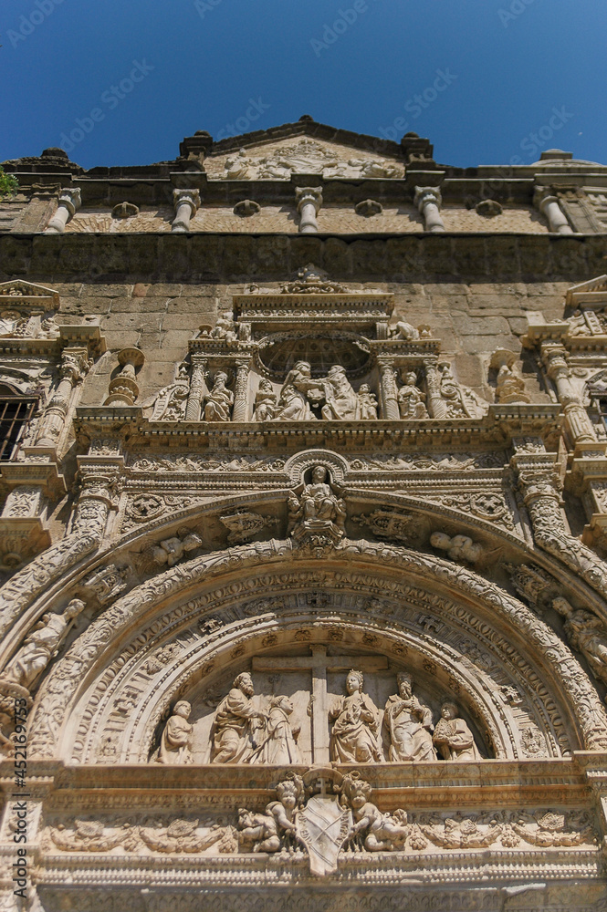 Fototapeta premium Old church entrance decoration with figures | Malaga, Spain
