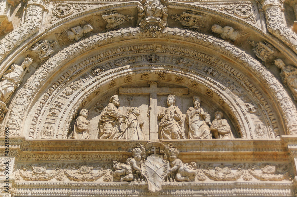 Old church entrance decoration with figures | Malaga, Spain