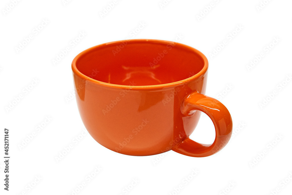 Orange empty clean round with handle ceramic coffee tea mug on isolated white background with space for text. Copy space. Minimal style. Concept layout for labeling and drinks placement