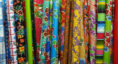 Colorful bright display of oilcloth fabric.   photo