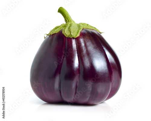 Segmented purple eggplant isolated on white background.