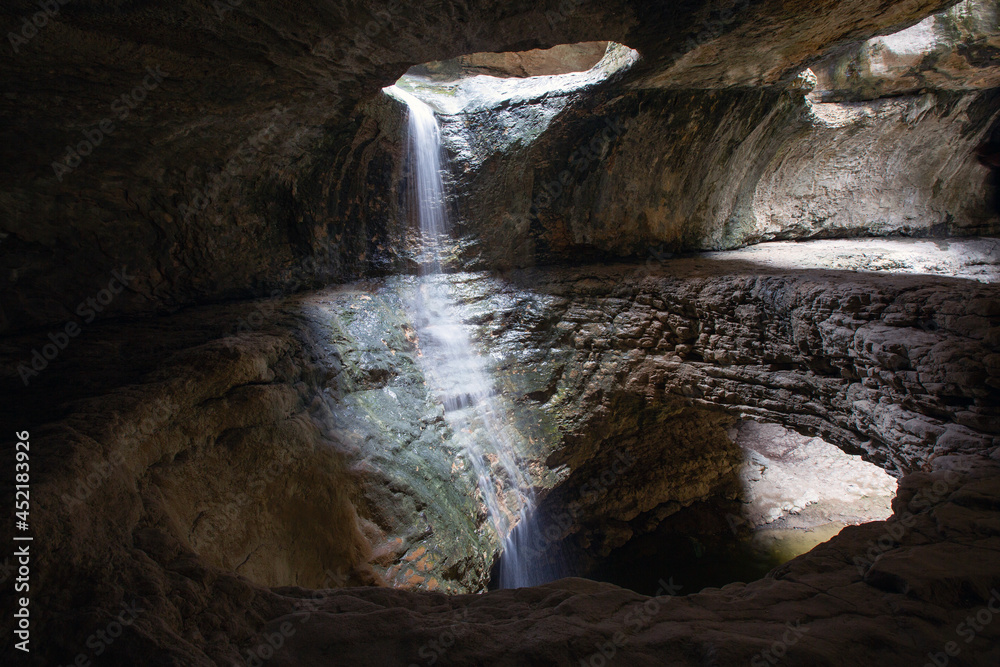 Naklejka premium Saltinsky, an underground waterfall in Dagestan - a natural landmark