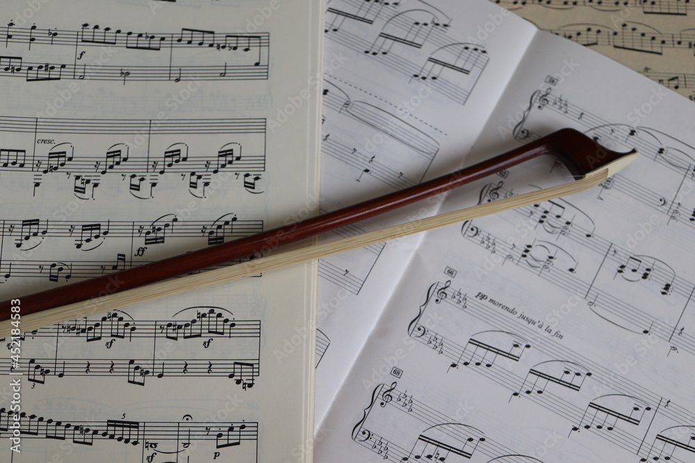 Fototapeta premium close up of a bow on musical scores 