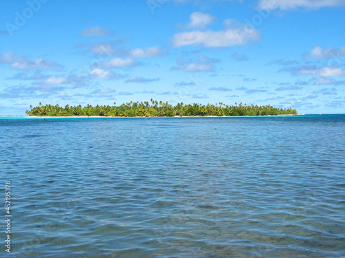 Motu - a small Polynesian island in an atoll / lagoon. photo