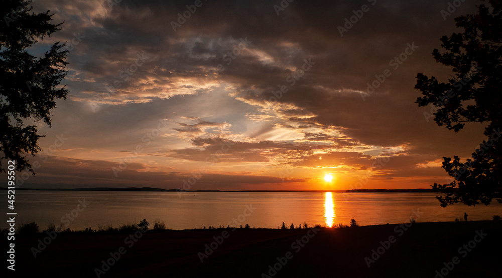 Sunset at on the lake with cloudscape