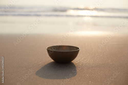 singing bowl sand background top view