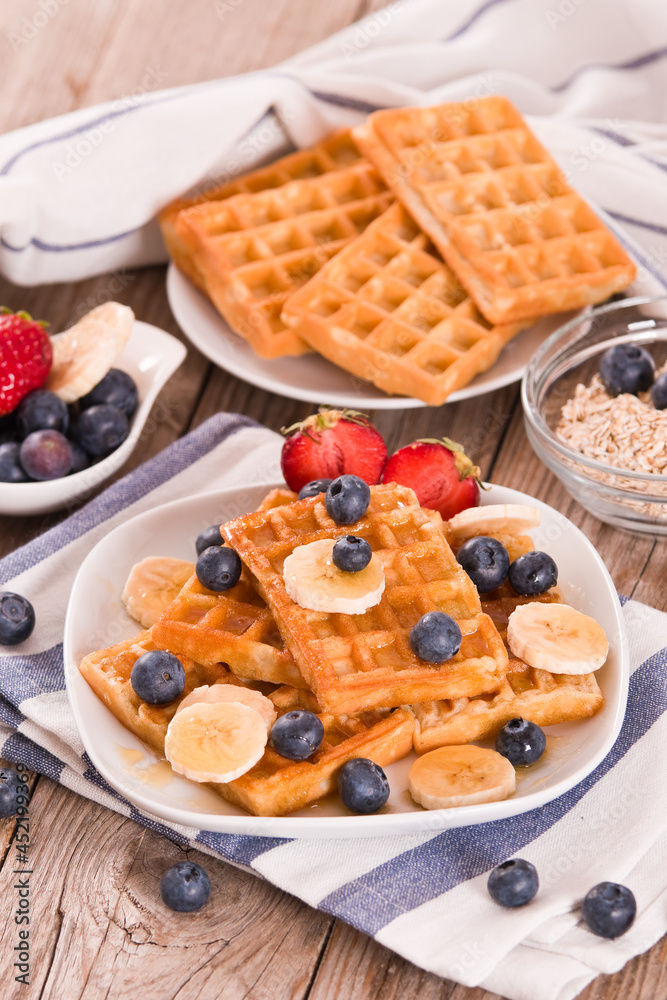 Waffles with blueberries, bananas and honey. Waffles with blueberries, bananas and honey.