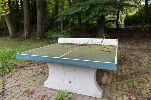 old table tennis table outside photo