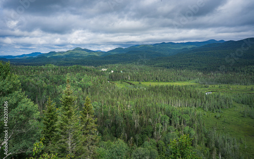 View on the Valin river and the Valin Mountain in summer from the Mirador hiking trail in Monts Valin National Park, in Quebec (Canada)