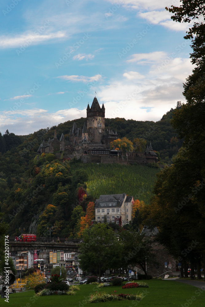 Chochem castle with autumn foliage and the beuatiful historic city in the foreground