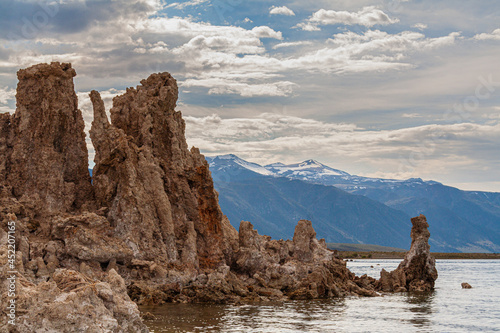 The Sierra Nevada mountains are framed by the tufa towers of Mono Lake. California.